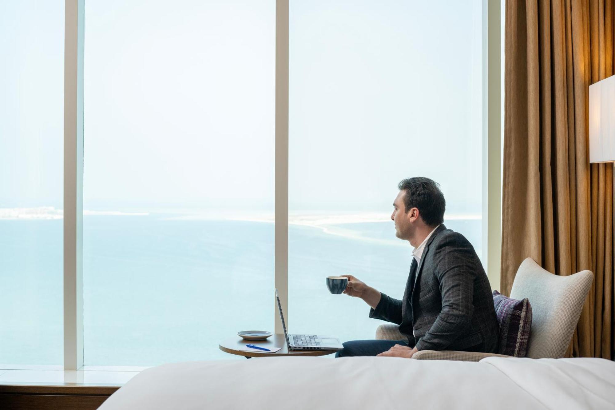 Delta Hotels By Marriott City Center Доха Екстер'єр фото A guest enjoying the view from a room at the hotel